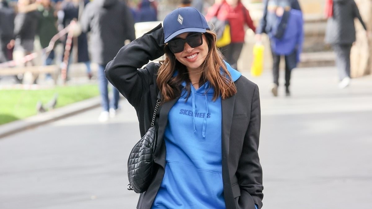 alert-–-myleene-klass opts-for-a-stylish-laid-back-look-in-a-blue-hoodie-and-cap-as-she-heads-to-work-at-smooth-radio