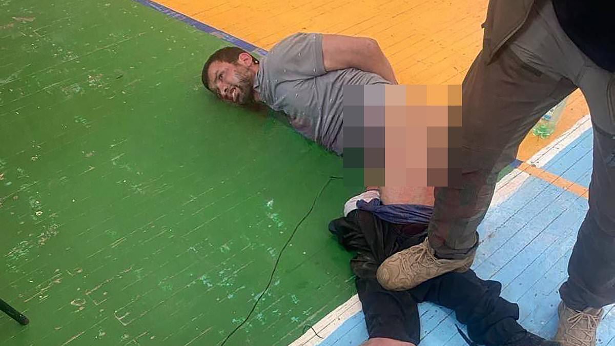 alert-–-russian-forces-torture-moscow-terror-suspect-by-hooking-his-genitals-up-to-80v-battery-leaving-him-foaming-at-the-mouth-–-and-feed-another-his-own-ear:-battered-men-appear-in-court-as-new-footage-emerges-of-the-slaughter-that-killed-at-least-140