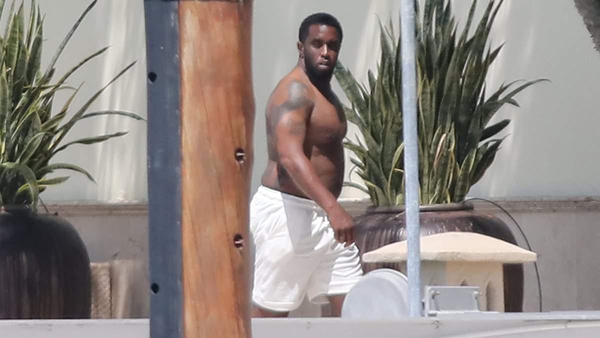 alert-–-diddy-steps-out-shirtless-for-a-smoke-and-takes-a-stroll-down-waterfront-pier-at-his-$35-million-miami-mansion-after-fbi-sex-trafficking-raids