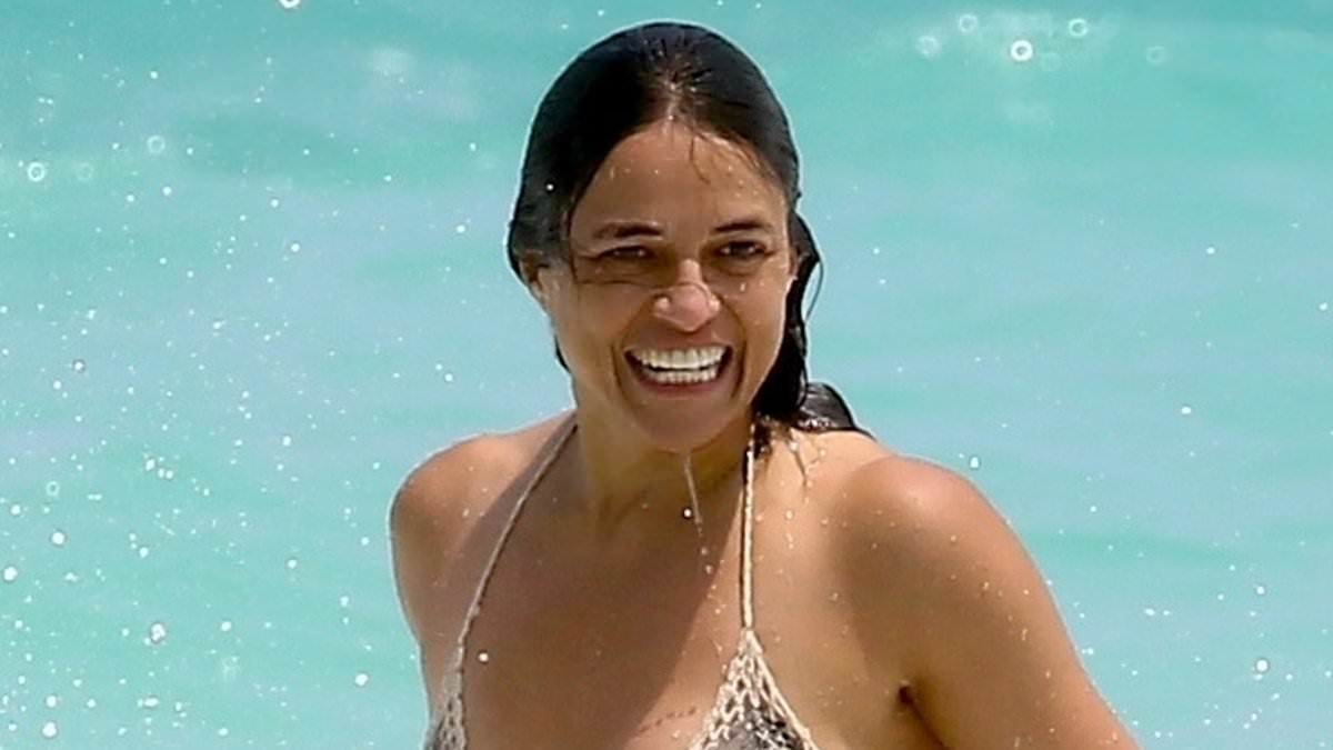 alert-–-michelle-rodriguez-and-carmen-vandenberg-don-tiny-bikinis-and-hold-hands-as-they-frolic-on-the-beach-during-cancun-getaway