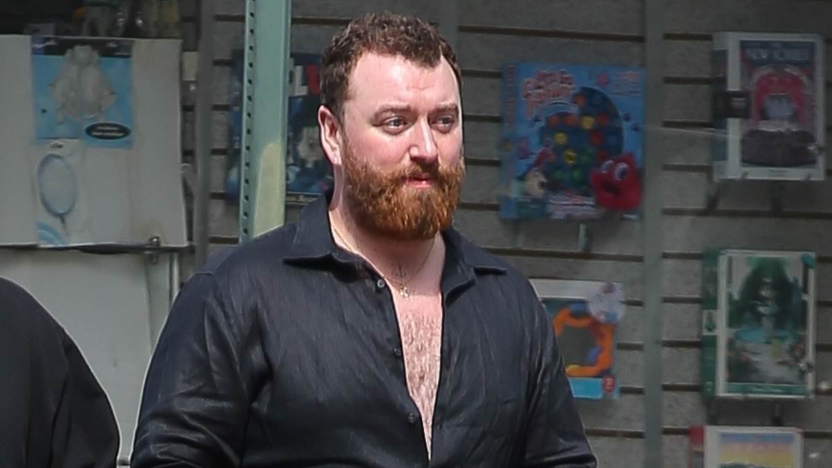 alert-–-sam-smith-displays-their-chest-in-a-semi-unbuttoned-shirt-as-they-step-out-for-a-walk-with-a-friend-in-new-york