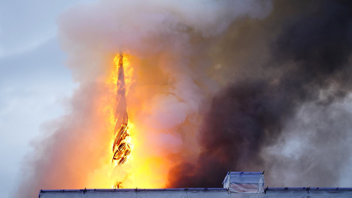 alert-–-moment-iconic-spire-of-copenhagen’s-stock-exchange-building-collapses-onto-the-street-below-as-fire-ravages-historic-building