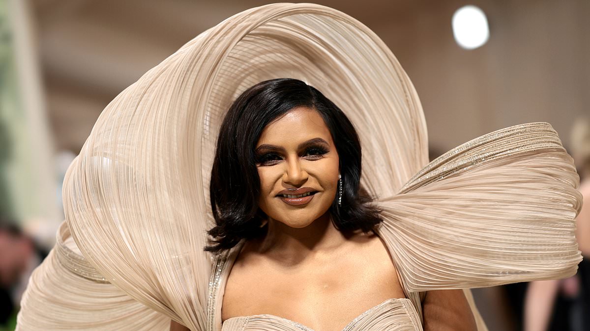 alert-–-mindy-kaling-glows-in-stunning-textured-beige-gown-with-a-long-train-trailing-behind-her-as-she-makes-a-splash-at-the-2024-met-gala