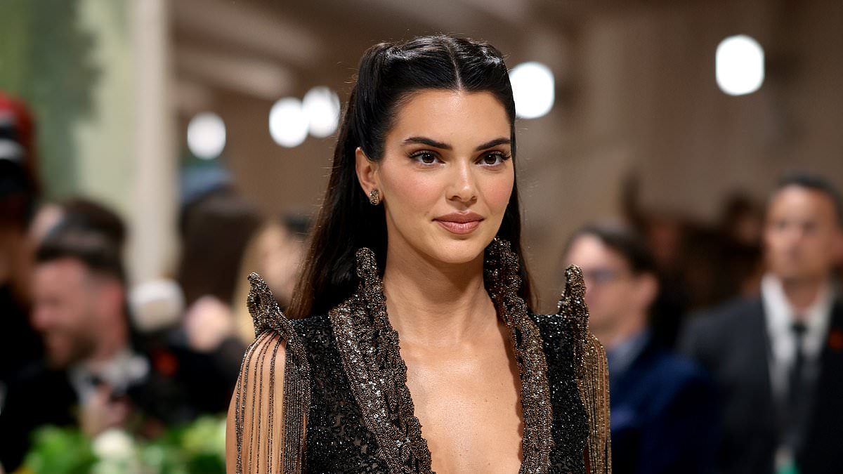 alert-–-kendall-jenner-puts-on-a-very-cheeky-display-in-a-semi-sheer-vintage-givenchy-dress-with derriere-cut-outs-as-she-sizzles-at-the 2024-met-gala