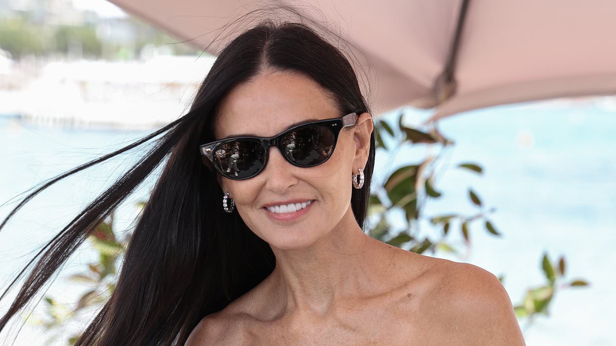 alert-–-demi-moore,-61,-looks-stylish-in-a-strapless-dress-as-she-cradles-her-beloved-chihuahua-pilaf-at-an-event-during-cannes-film-festival