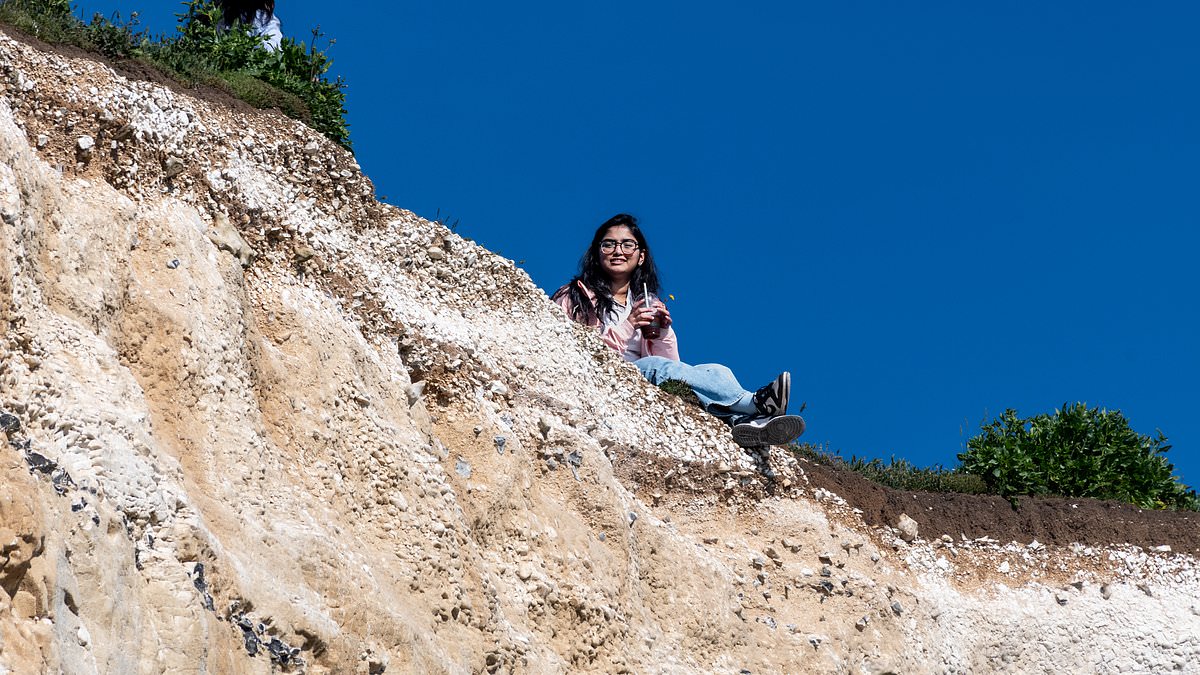 alert-–-mind-your-step!-sunseekers-lurk-perilously-close-to-crumbling-cliff-edge-as-they-flock-to-beauty-spot-to-take-advantage-of-warm-bank-holiday-weather