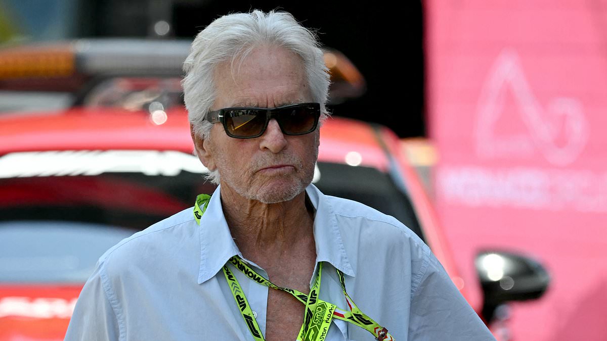 alert-–-michael-douglas,-79,-keeps-it-casual-in-unbuttoned-shirt-and-cargo-pants-as-he-takes-over-pit-lane-at-star-studded-f1-grand-prix-in-monaco