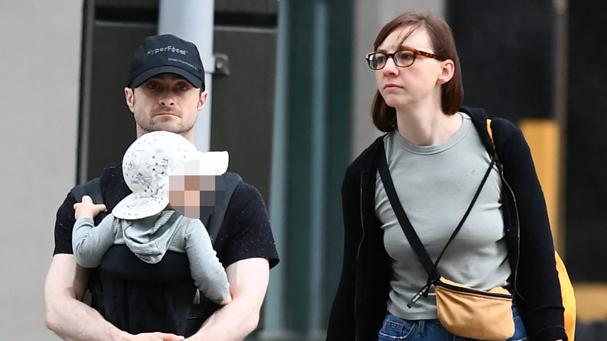 alert-–-daniel-radcliffe-cradles-his-son,-13-months,-on-a-family-stroll-with long-term-partner-erin-darke-in-new-york