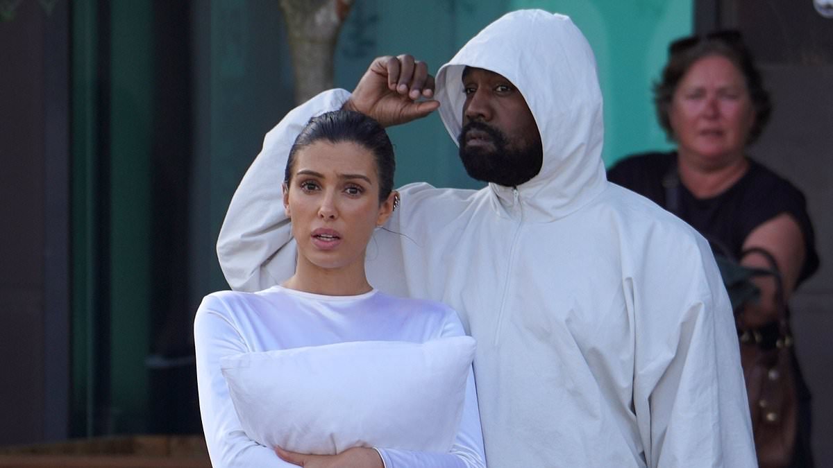 alert-–-kanye-west’s-wife-bianca-censori-clutches-pillow-over-her-chest-in-a-thong-bodysuit-as-she-revives-the-daring-look-during-pair’s-return-to-italy