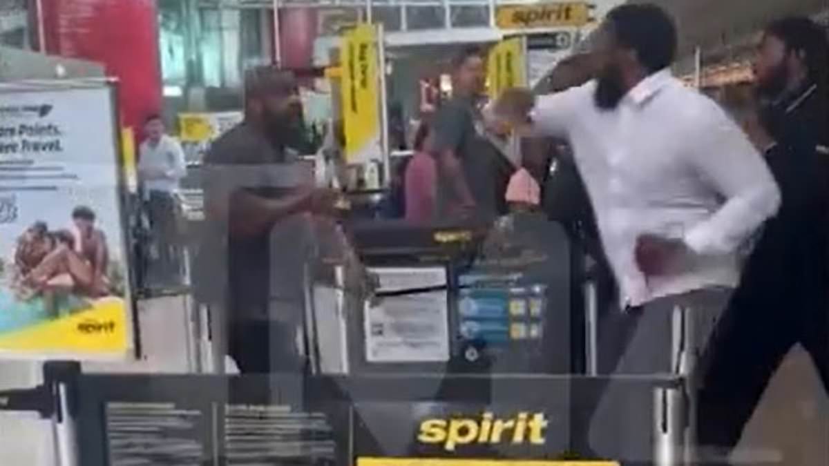 alert-–-five-men-brawl-at-spirit-airlines-check-in-desk-at-baltimore-airport,-tumbling-to-floor-and-getting-tangled-in-retractable-barriers