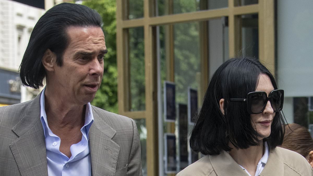 alert-–-still-smiling!-nick-cave-and-his-glamorous-wife-susie-bick-put-on-a-rare-public-display-of-affection-as-they-step-out-in-london-after-years-of-personal-tragedies