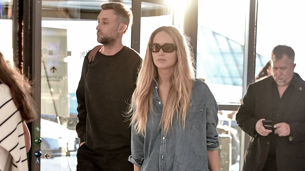 alert-–-jennifer-lawrence-keeps-it-low-key-in-casual-double-denim-as-she-and-husband-cooke-maroney-are-spotted-at-jfk-airport-in-nyc