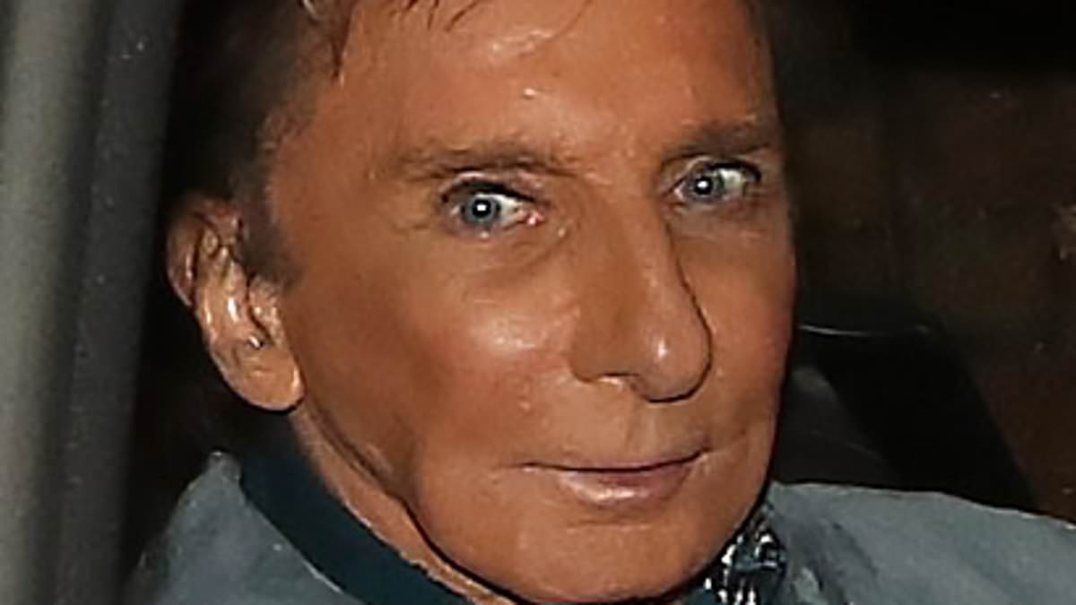 alert-–-barry-manilow,-80,-is-seen-wearing-a-hearing-aid-as-he-puffs-on-a-vape-while-leaving-farewell-show-at-the-london-palladium