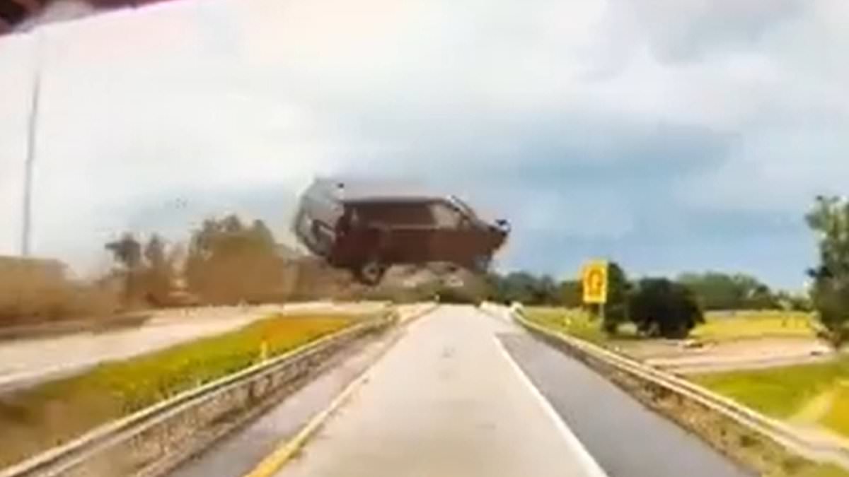 alert-–-wild-moment-suv-goes-mega-airborne-in-front-of-truck-driving-on-michigan-highway