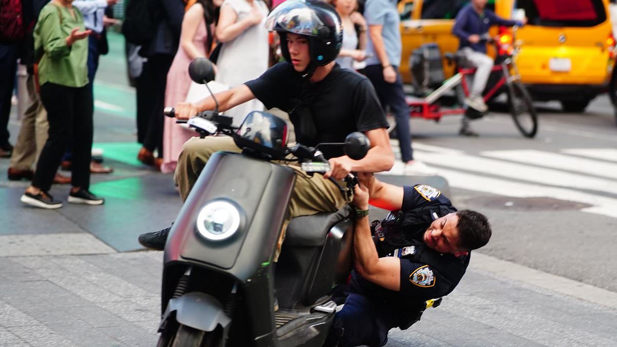 alert-–-moment-nypd-officer-tackles-a-moped-driver-as-part-of-ongoing-crackdown-following-incidents-of-scooters-being-used-for-crimes-around-the-big-apple