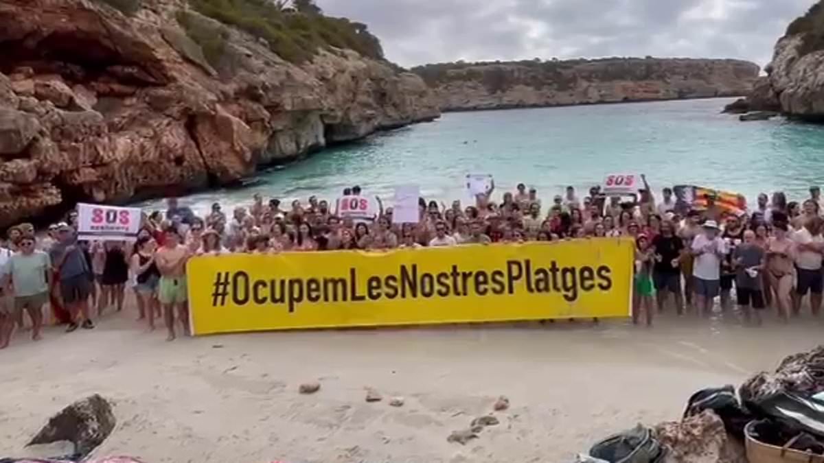 alert-–-hundreds-of-majorcans-take-over-tiny-picture-postcard-cove-made-famous-by-instagram-‘influencers’-and-unfurl-banners-reading-‘sos-residents’-amid-spanish-island’s-anti-tourism-backlash-against-uk-holidaymakers