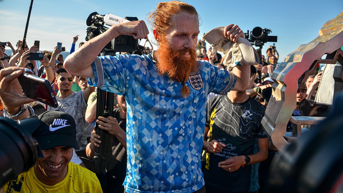 alert-–-‘hardest-geezer’-russ-cook-arrives-in-germany-for-euros-after-running-352-miles-to-support-england-–-and-predicts-three-lions-victory-over-serbia