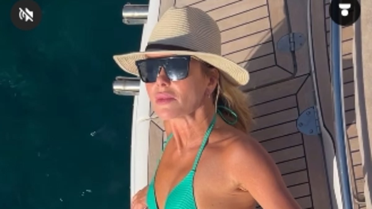 alert-–-amanda-holden,-53,-leaves-little-to-the-imagination-as-she-shows-off-her-toned-physique-in-a-tiny-emerald-green-bikini-during-latest-sunshine-break