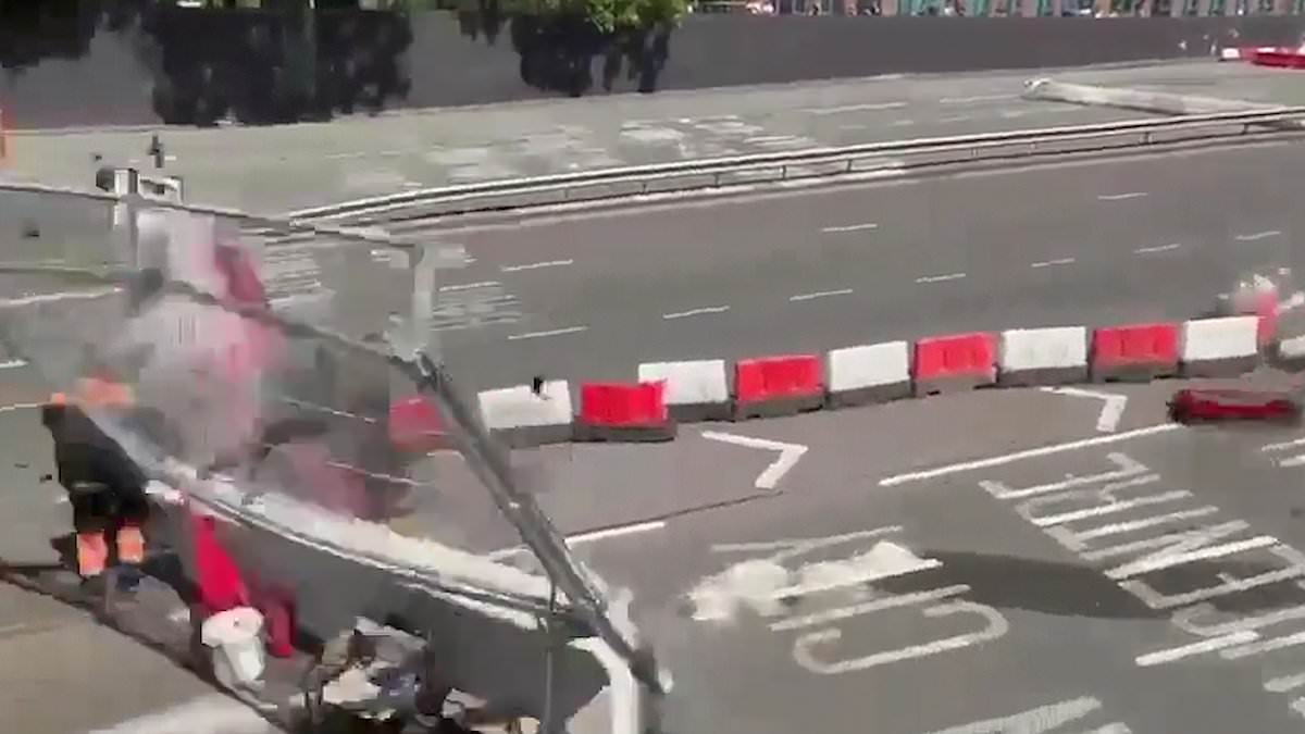 alert-–-heart-stopping-video-reveals-how-race-marshal-narrowly-dodges-death-after-car-loses-control-on-track-and-comes-flying-towards-him-–-before-smashing-into-a-concrete-barrier