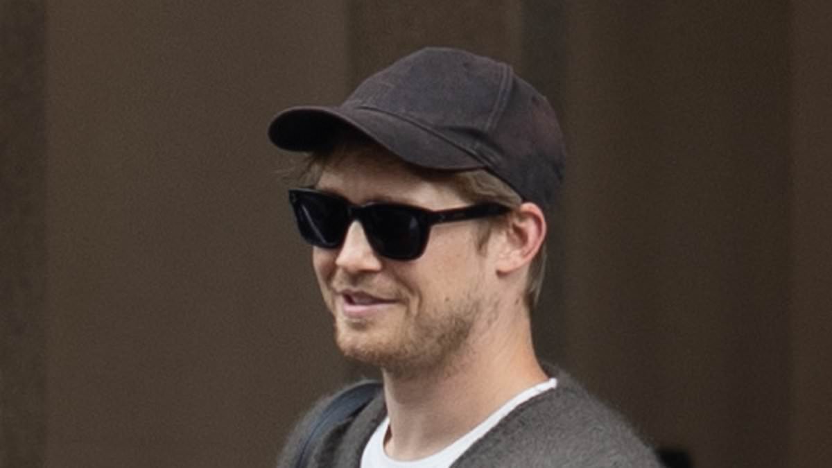 alert-–-joe-alwyn-shields-his-face-with-a-baseball-cap-and-sunglasses-as-he-makes-a-low-key-arrival-in-milan-after-breaking-silence-on-taylor-swift-split