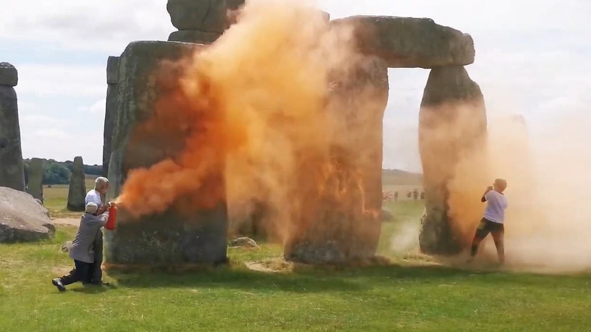 alert-–-just-stop-oil-spray-stonehenge-with-orange-paint-as-heroic-passer-by-steps-in-to-try-to-drag-them-away