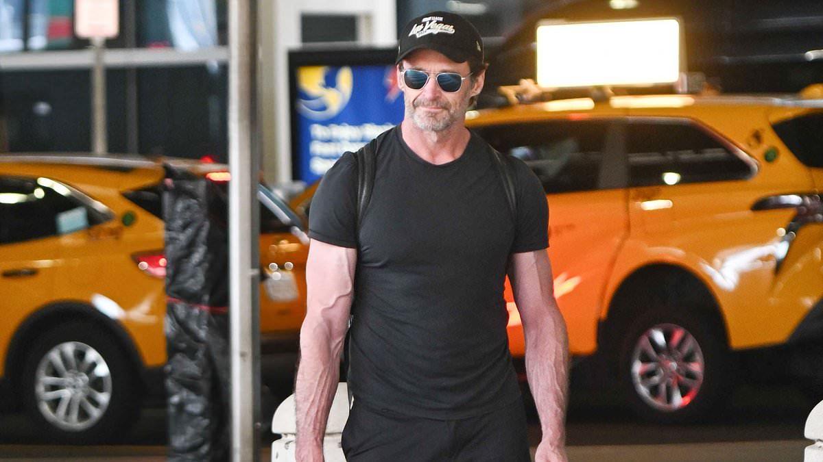 alert-–-hugh-jackman-shows-off-his-lean-and-muscular-wolverine-physique-while-carrying-a-guitar-bag-at-jfk-airport-in-new-york