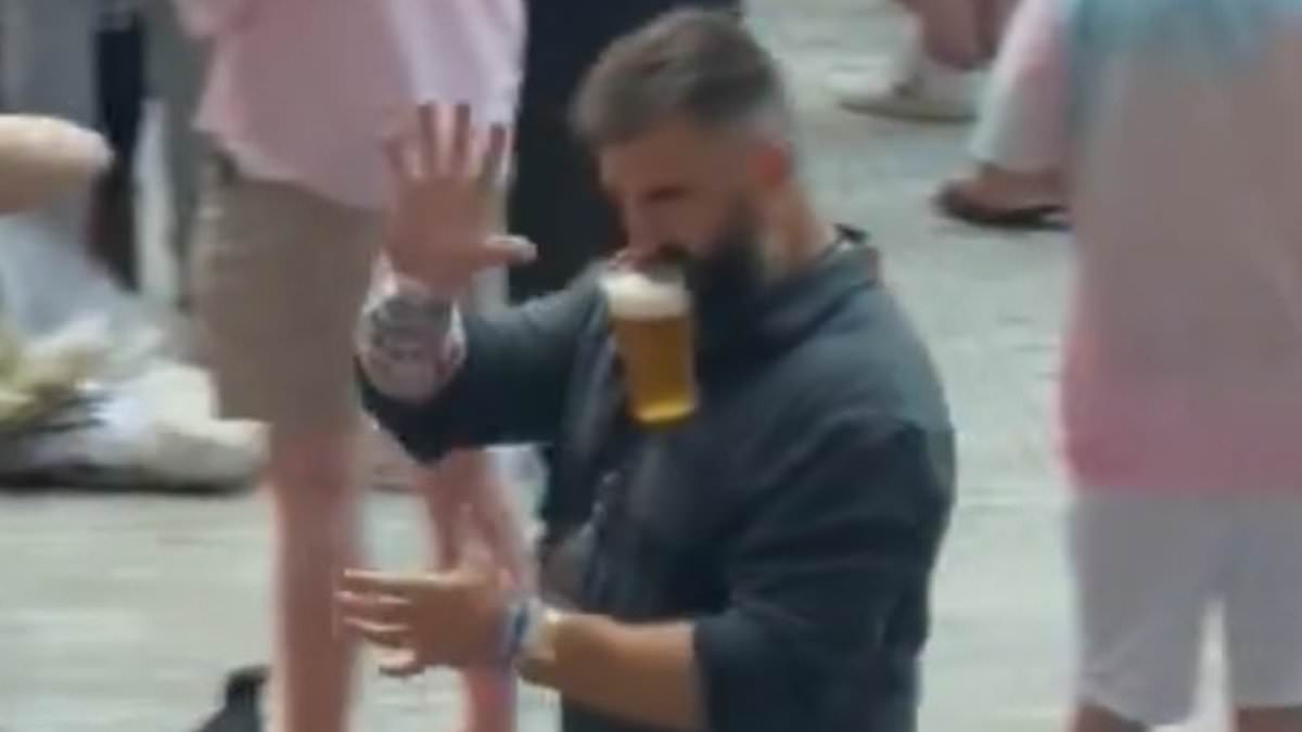 alert-–-taylor-swift-fans-fall-in-love-with-‘living-legend’-jason-kelce-as-he-is-spotted-hanging-friendship-bracelets-off-his-ears-and-carrying-a-beer-with-his-mouth-at-eras-tour-show-in-london