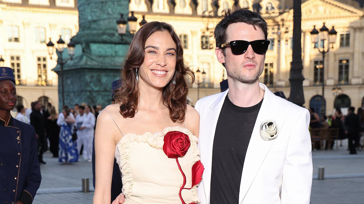 alert-–-alexa-chung-looks-typically-chic-in-a-red-rose-design-dress-as-she-joins-her-boyfriend-tom-sturridge-at-the-star-studded-vogue-world:-paris