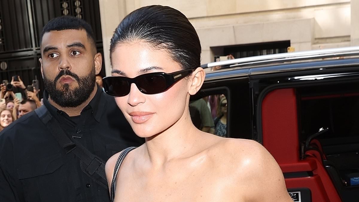 alert-–-kylie-jenner-displays-her-toned-figure-in-a-leather handkerchief-crop-top-and-matching-skirt-as-she-arrives-at-the-ritz-hotel-in-paris-during-fashion-week