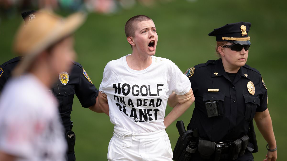 alert-–-climate-change-protestors-disrupt-travelers-championship-after-storming-18th-green-before-crucial-scottie-scheffler-putt