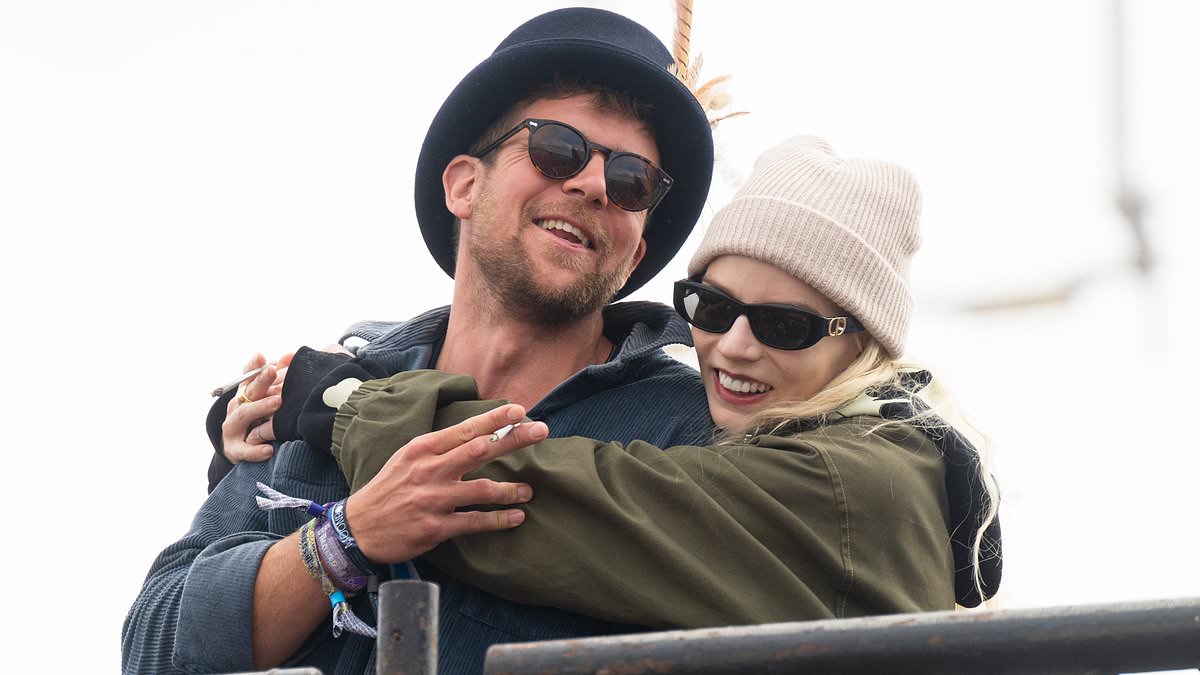 alert-–-anya-taylor-joy-can’t-wipe-the-smile-off-her-face-as-she-wraps-her-arms-around-a-friend-on-the-last-day-of-glastonbury-festival