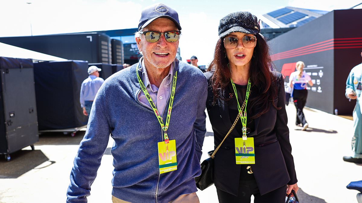 alert-–-catherine-zeta-jones,-54,-cosies-up-to-her-husband michael-douglas,-79,-as-they-enjoy-a-day-out-at-the-star-studded-british-grand-prix