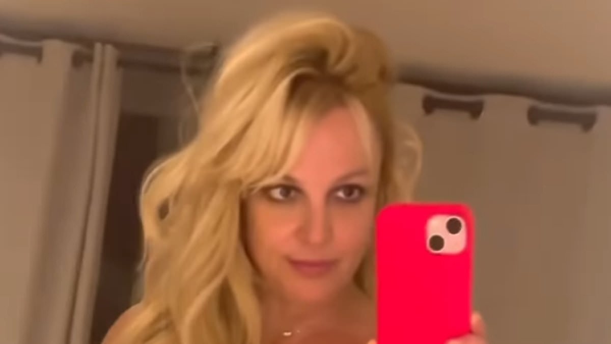 alert-–-britney-spears-models-plunging-mesh-minidress-before-changing-into-sexy-off-the-shoulder-yellow-number-in-dressing-room-clips