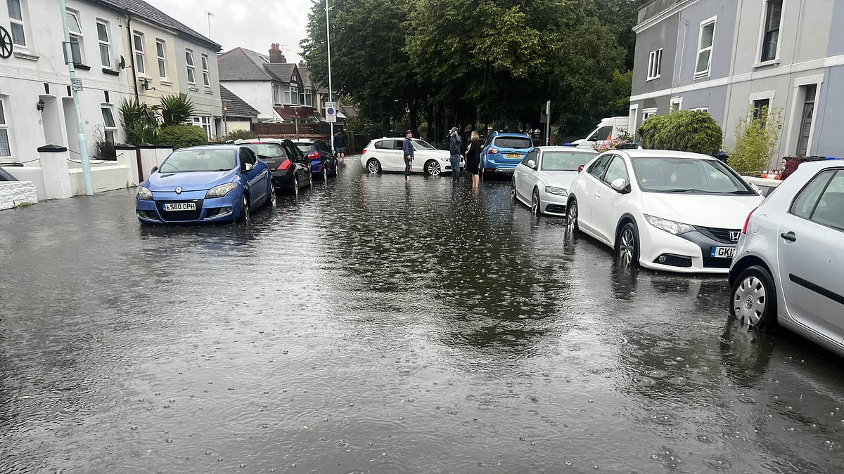 alert-–-inches-of-rain-fall-within-just-hours-as-more-torrential-downpours-set-to-hit-parts-of-uk-today-with-beaches-deserted,-bbqs-packed-away-and-brits-reaching-for-their-winter-roasts