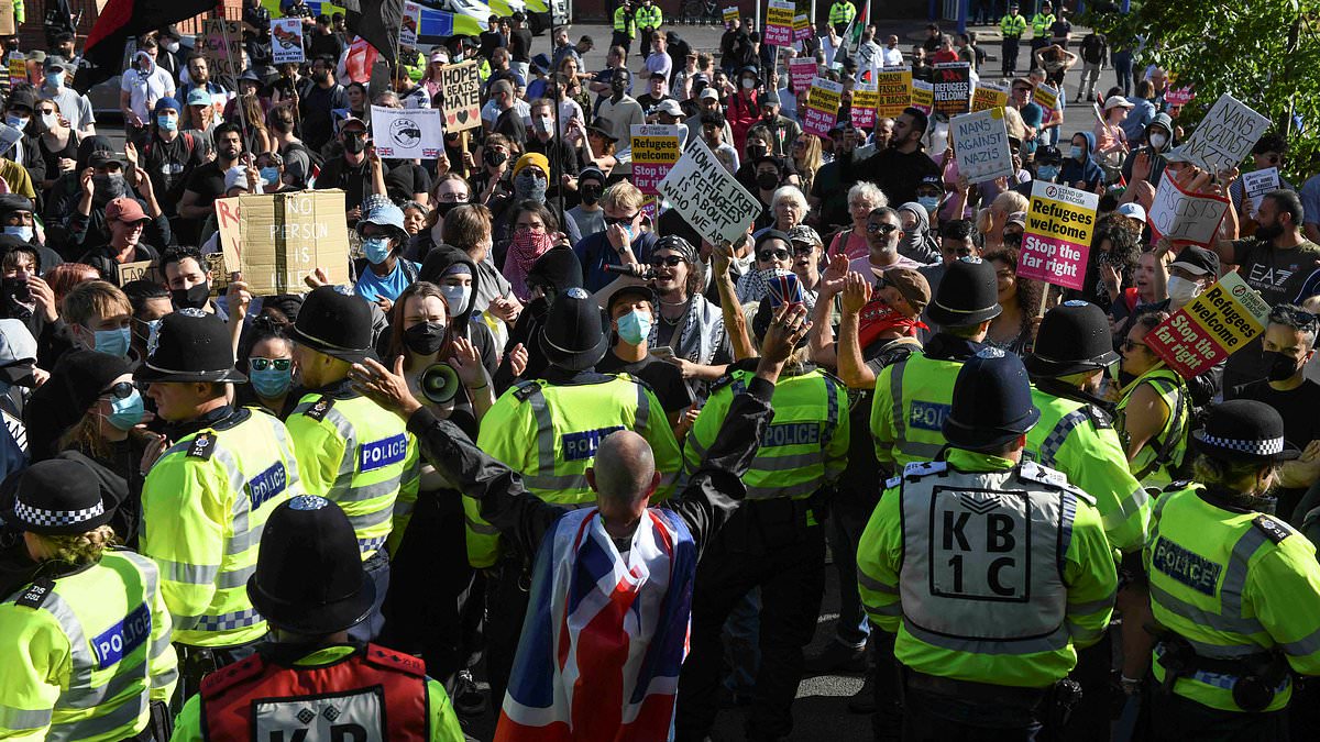 alert-–-far-right-support-dwindles-as-handful-of-thugs-are-confronted-by-hundreds-of-anti-fascist-protesters-at-asylum-hotel-in-crawley-–-but-police-are-still-bracing-for-a-weekend-of-fresh-riots-while-masked-demonstrators-are-already-clashing-in-belfast