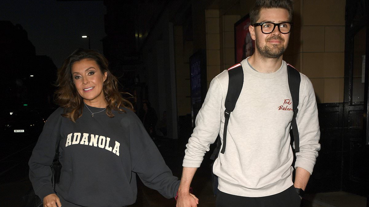 alert-–-kym-marsh,-48,-puts-on-loved-up-display-with-toyboy-boyfriend-samuel-thomas,-29,-as-they-leave-the-theatre-after-101-dalmatians-the-musical