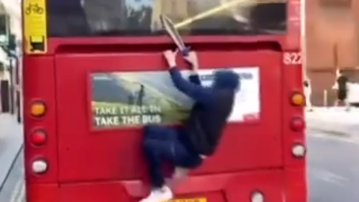 alert-–-shocking-moment-youth-armed-with-a-large-knife-clings-to-the-back-of-a-double-decker-bus-in-brighton-as-he-hitches-a-ride-around-town