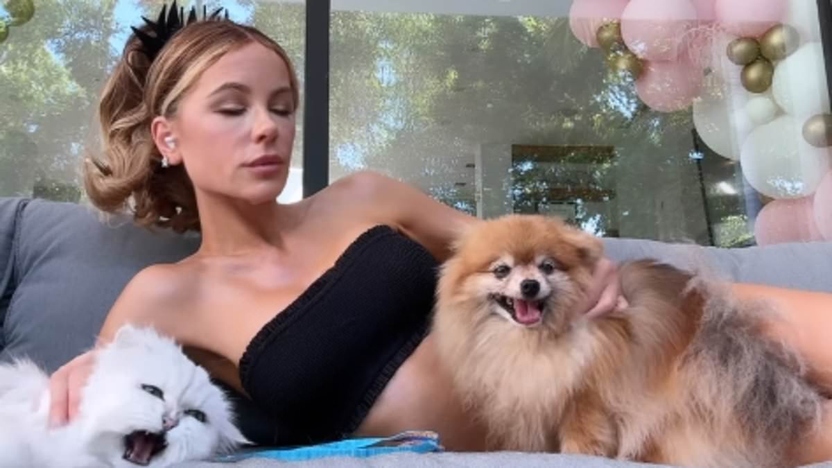 alert-–-kate-beckinsale,-51,-shows-off-her-toned-abs-in-tiny-bikini-as-she-poses-with-her-cat-and-dog-before-the-feline-leaves-her-with-nasty-injury