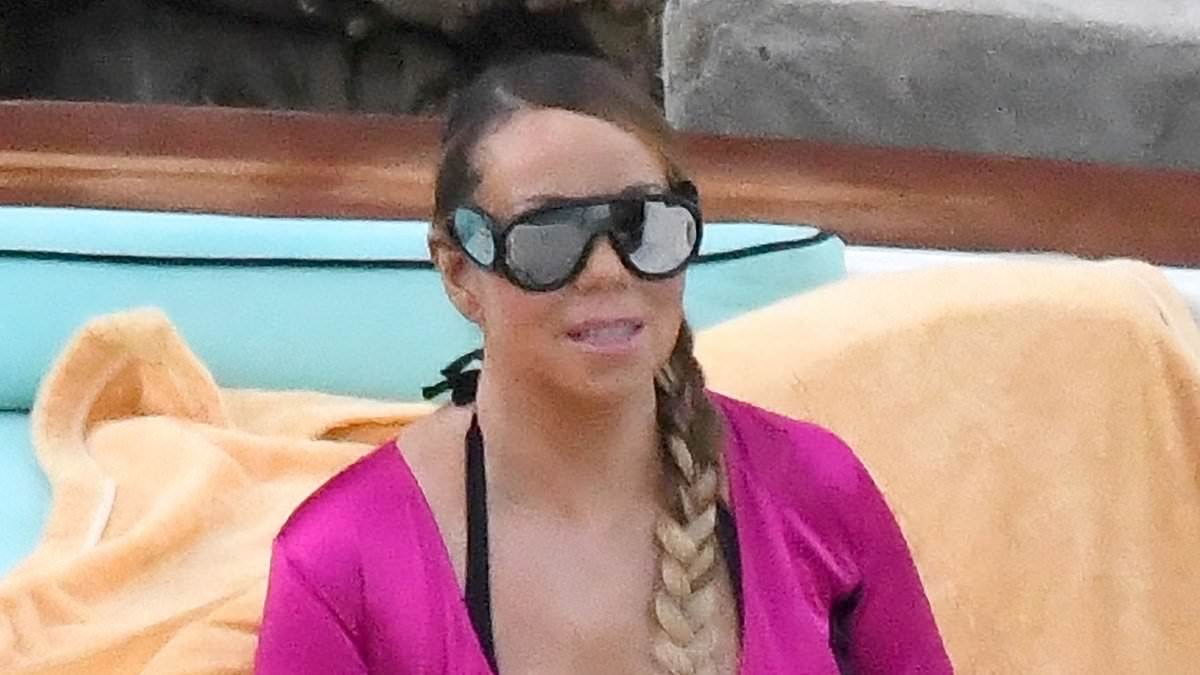 alert-–-mariah-carey,-55,-puts-on-a-busty-display-in-a-plunging-pink-wetsuit-as-she-enjoys-a-boat-ride-in-italy-with-twins-monroe-and-moroccan,-13