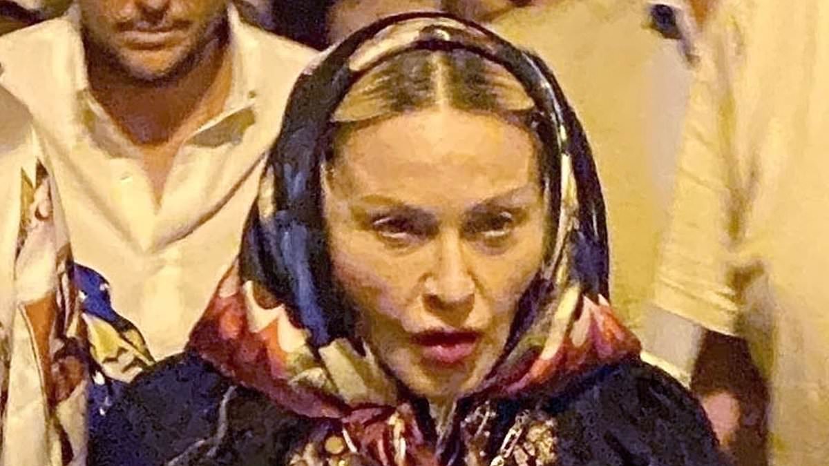 alert-–-madonna,-66,-looks-exhausted-as-she-is-helped-along-the-cobbled-streets-of-terracina-by-new-love-akeem-morris,-28,-after-long-day-of-italian-sightseeing