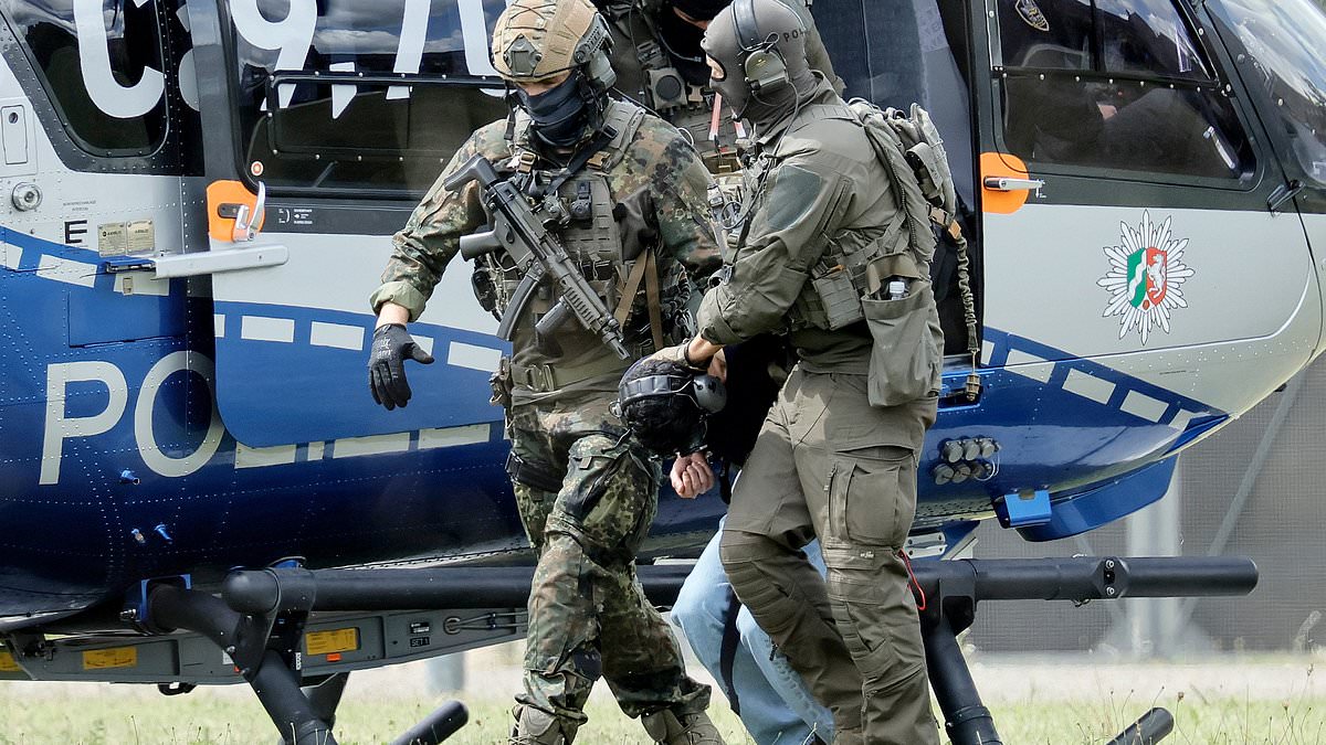 alert-–-moment-german-police-drag-terror-suspect-out-of-helicopter:-asylum-seeking-syrian,-26,-who-handed-himself-in-over-festival-attack-that-left-three-dead-is-named-and-hauled-before-court