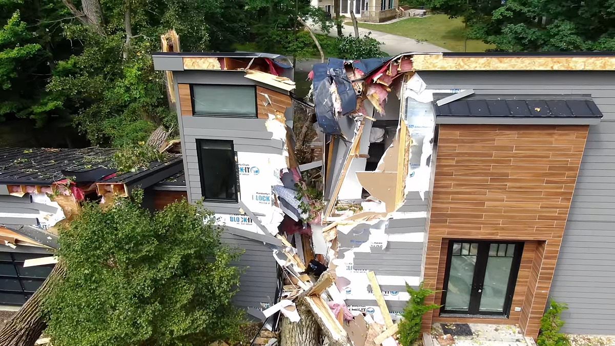 alert-–-shocking-drone-footage-shows-entire-house-split-in-two-by-felled-trees-from-michigan-storm-that-left-millions-without-power