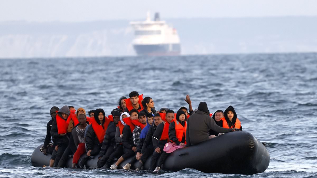 alert-–-moment-dangerously-overcrowded-migrant-boat-is-‘seconds-from-sinking’-in-channel-shipping-lane-–-as-french-navy-watches-on