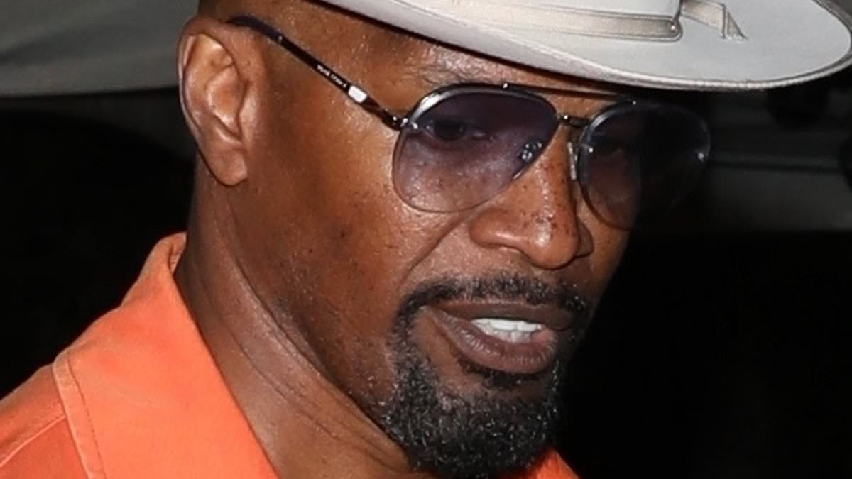 alert-–-jamie-foxx-commands-attention-in-a-bright-orange-jacket-as-he-signs-autographs-for-fans-after-opening-up-about-his-mystery-illness