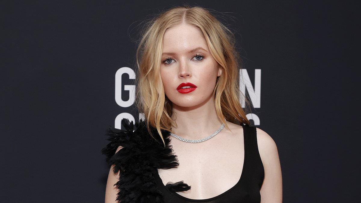 alert-–-ellie-bamber-puts-on-a-racy-display-in-a-ruffled-sheer-black-dress-as-she-poses-up-a-storm-at-toronto-international-film-festival golden-globes-bash