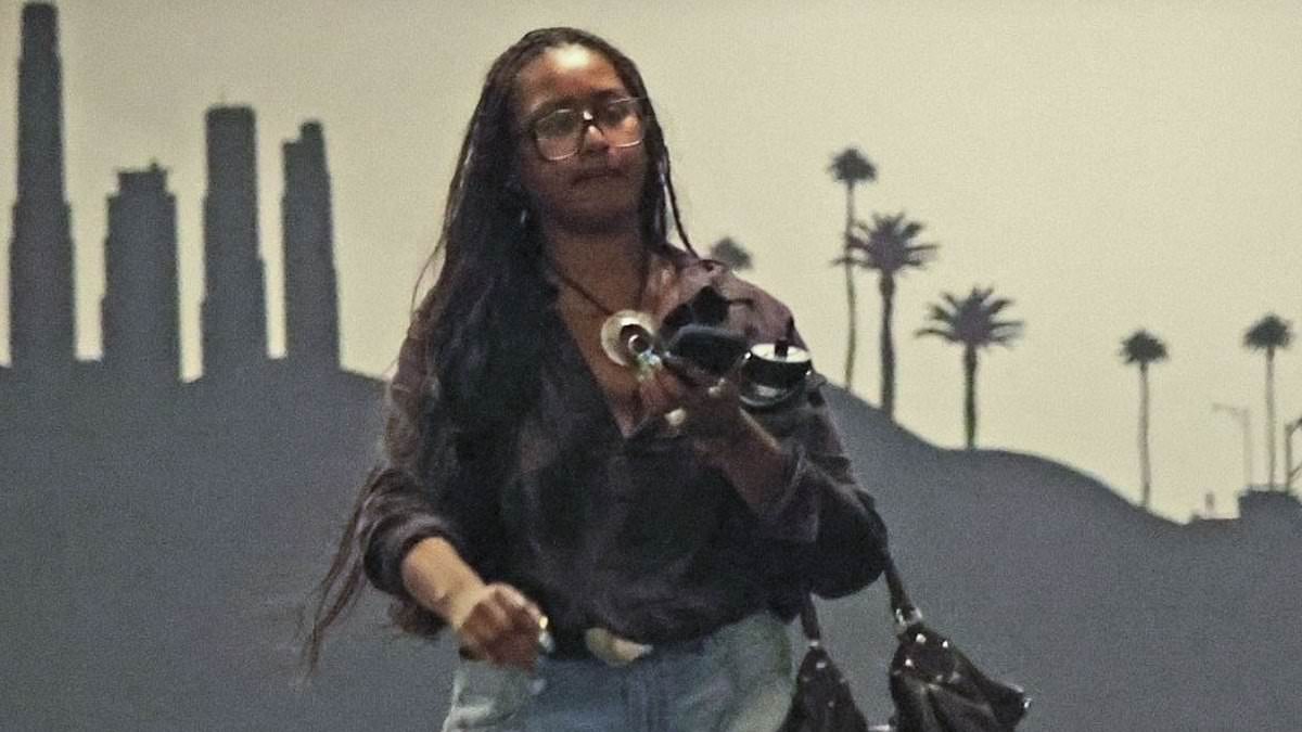 alert-–-sasha-obama,-23,-looks-thoughtful-as-she-steps-out-in-jean-cut-offs-before-puffing-on-a-cigarette-in-her-car-in-beverly-hills