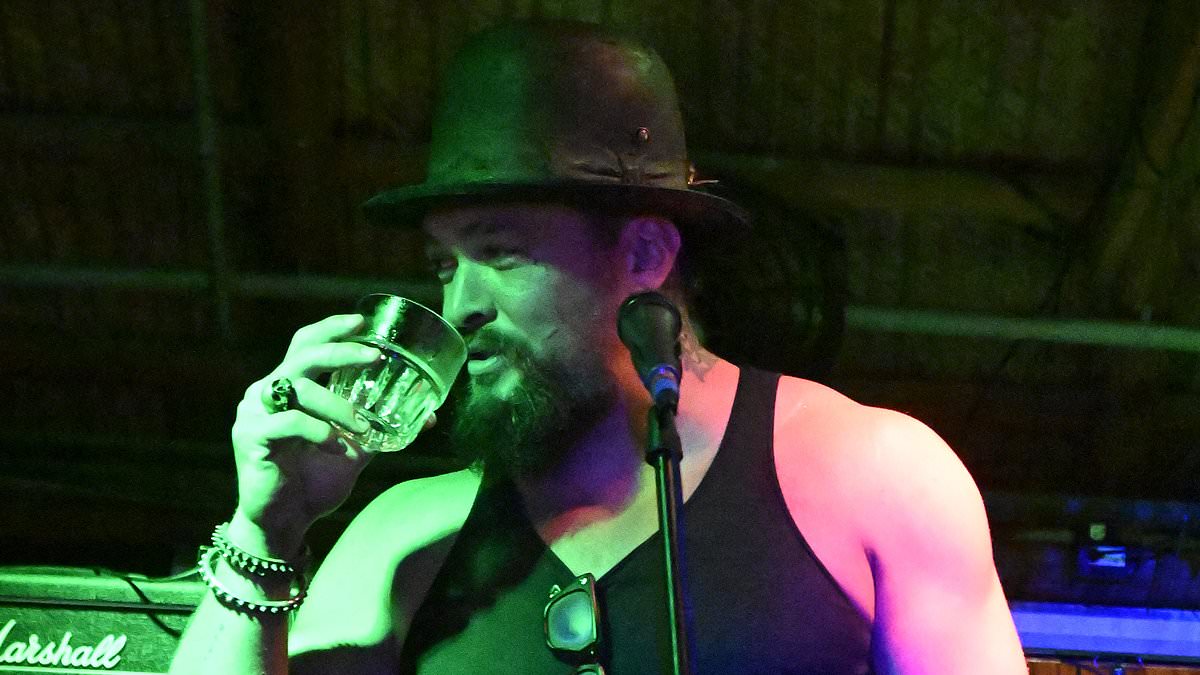 alert-–-jason-momoa-swigs-a-drink-onstage-with-his-band-after-shock-claim-he-‘mistreated’-crew-on-minecraft-film