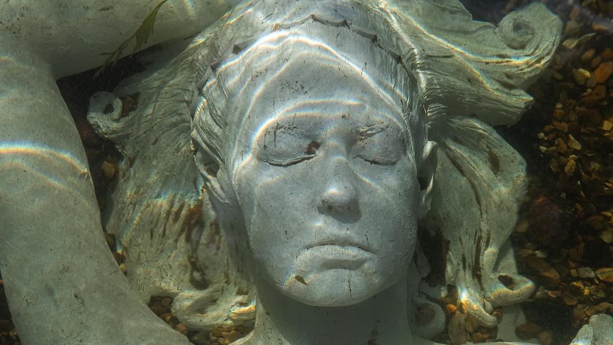 alert-–-furious-homeowners-in-picturesque-english-town-slam-‘distasteful’-underwater-sculpture-that-passersby-confuse-for-a-drowned-woman