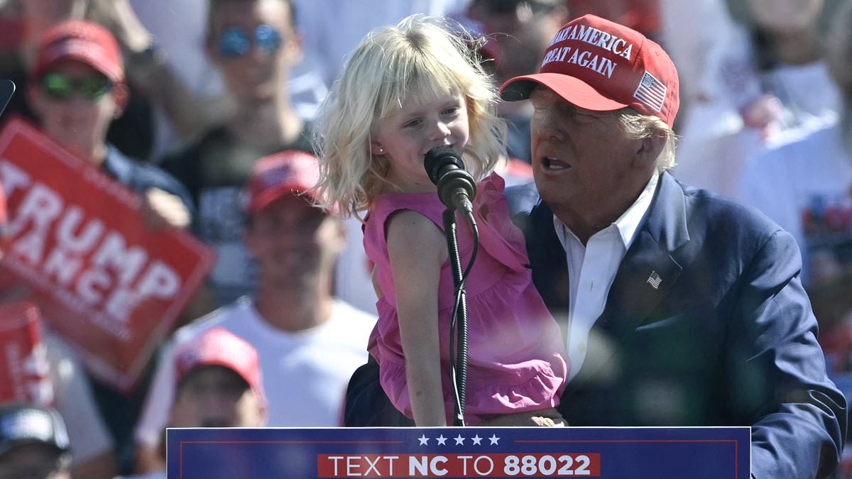 alert-–-adorable-moment-trump’s-young-granddaughter-repeats-his-famous-catchphrase-to-crowd-in-north-carolina-from-behind-bulletproof-screen-–-as-scandal-hit-ally-skips-rally