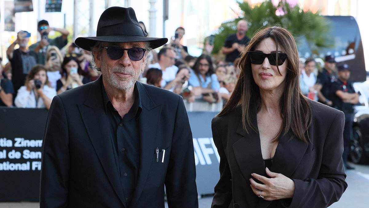 alert-–-monica-bellucci,-59,-flashes-her-lingerie-under-a-chic-suit-as-she-holds-hands-with-partner-tim-burton,-66,-at-the-72nd-san-sebastian-film-festival